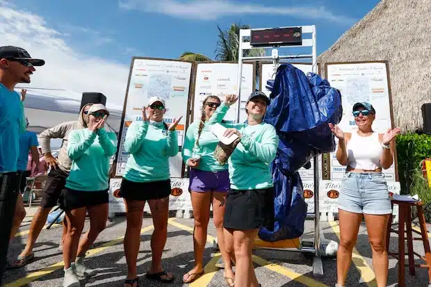 The If It Has Eyes, It Dies team celebrates after the trash they collected weighs 72.42 pounds during the Suncoast Ladies’ Classic at Tiki Docks Skyway Bar and Grill on July 13 in St. Petersburg. [ JEFFEREE WOO | Times ]